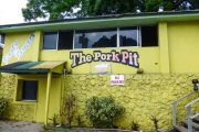 Yellow building with Pork pit written on it