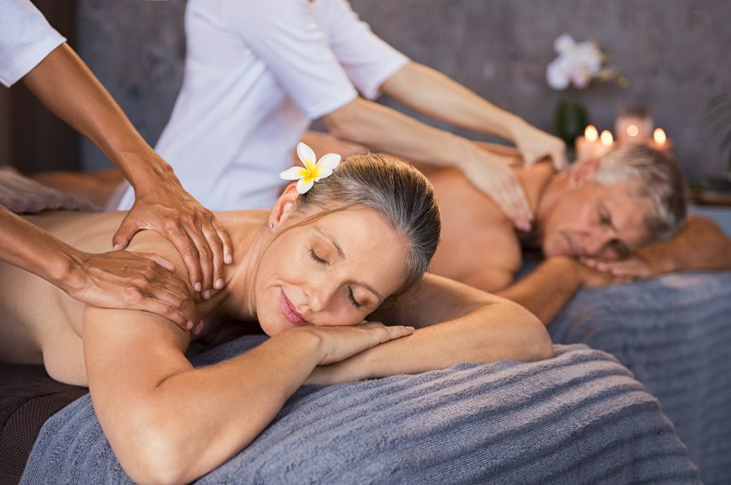 Senior couple using Sunlife Tours JA mobile spa service to get a massage